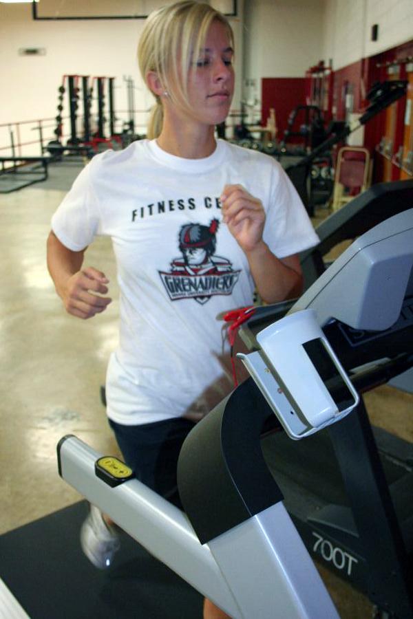 C.J. Combs, English senior, works out on a treadmill in the Activities Building.