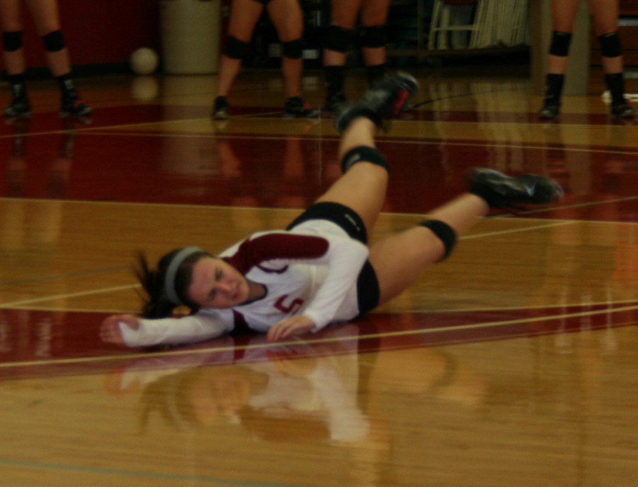 Stephanie Bradshaw, freshman defensive specialist, hits the floor for an attempt at a dig on Oct. 20.