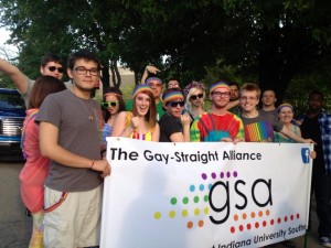 Members of the IU Southeast Gay-Straight Alliance showed their colors in the Kentuckiana Pride Parade June 14. Banner holders from left to right: Justin Armenta, psychology junior, Mallory Murphy, international business and marketing sophomore, Dylan Kidwell, English and French sophomore and GSA President, Calvin Barron, education sophomore, Geoff Hutton, vocal performance alumnus and Amanda Abell, general studies alumna.