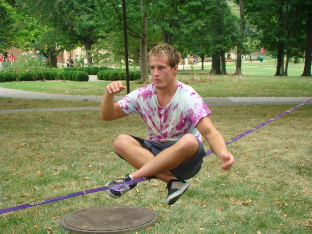 Tyler Newcomb, philosophy freshman, practices slacklining outside Crestview Hall. Newcomb frequently practices in between classes.  
