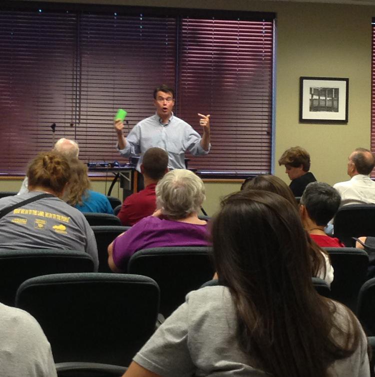 Todd Young speaks to students and community members at a town hall forum. 