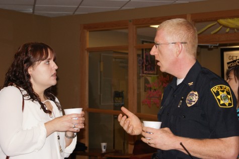 Chief Charles Edelen answers questions and socializes with students at the Coffee with a Cop event held at University Grounds.