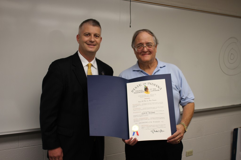 Photo courtesy Carl Kramer (right) stands with Indiana State Senator Jim Smith (left). Smith surprised Kramer with the award during Kramer's US history class. 