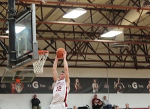 Junior guard, Jake Simpson goes up for a big dunk that put the Grenadiers up 39-31 with 4:03 left in the first half.  