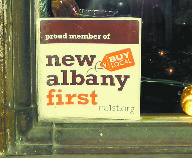 This sticker, tucked inside the window of Colokial, shows that the boutique is a member of New Albany First, a non-profit organization that supports local businesses.