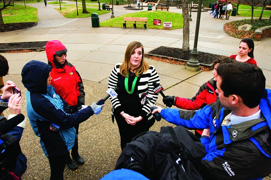 Southeast Erica Walsh, IUS public relations specialist, speaks to reporters on Thursday, Dec. 5, 2013, after the campus was locked down for nearly 45 minutes in response to a possible threat. Photo by Christopher Fryer/News and Tribune (used with permission).