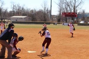 Senior pitcher Jenna Swain slings a fast ball in to an opposing hitter during Saturday's double header.  Swain went 10-3 last year with a team high 99 strikeouts.