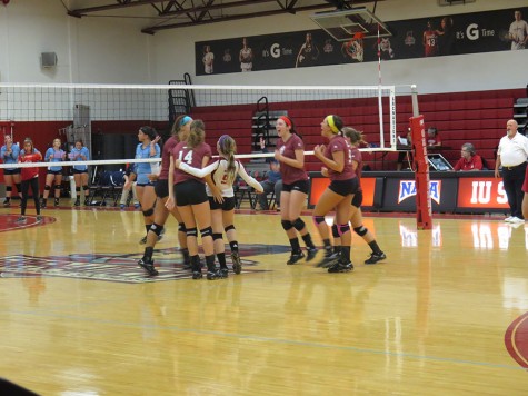 The Grenadiers celebrate winning a point in the fourth set in
Thursday night’s game against Oakland City.