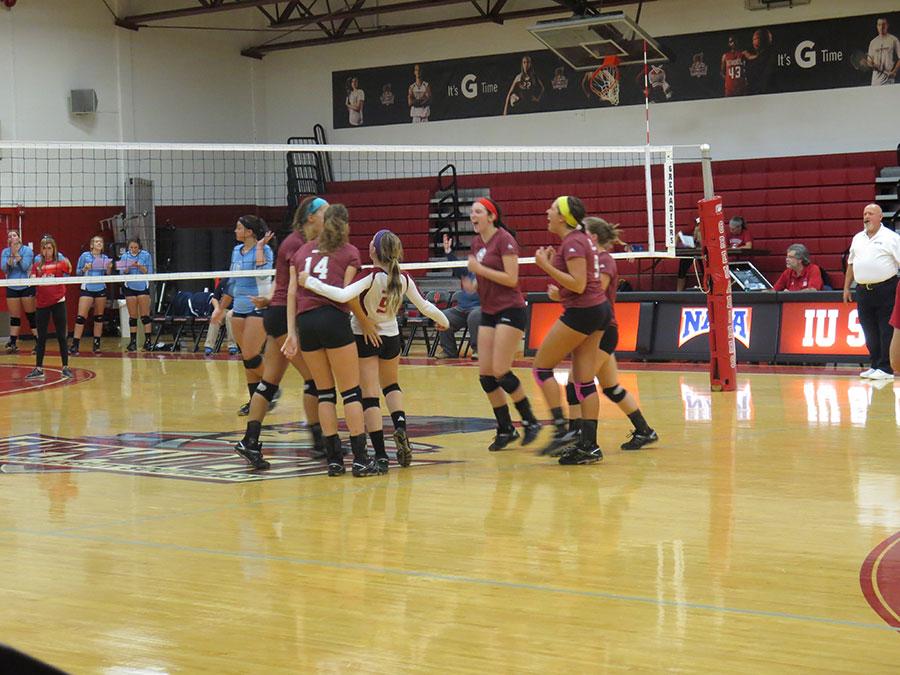 The Grenadiers celebrate winning a point in the fourth set in
Thursday night’s game against Oakland City.
