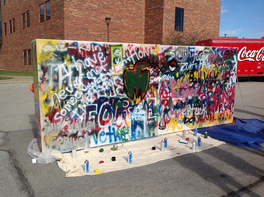 IU Southeast German Club members decorate the mock Berlin Wall  at IU Southeast in 2013 (courtesy photo)