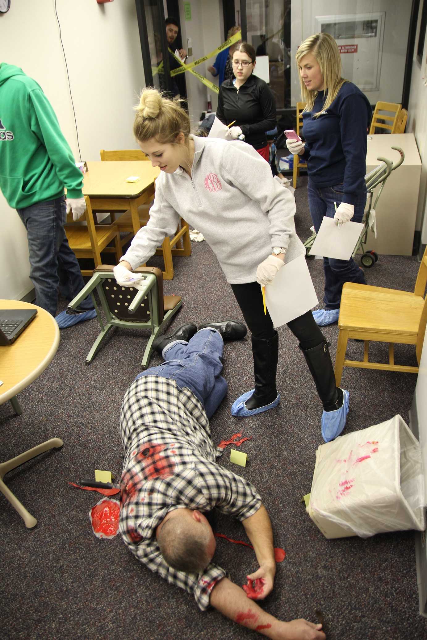 Students+learn+from+mock+crime+scene+in+Crestview+Hall