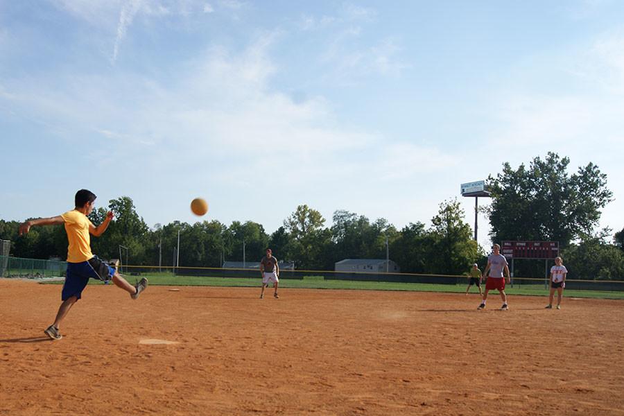 Adam Diaz, accounting junior, boots a ball to deep left field during intramurals on Friday, Sept. 18. Diaz is a member of the Kappa Sigma fraternity. He enjoys kickball for its competitiveness.