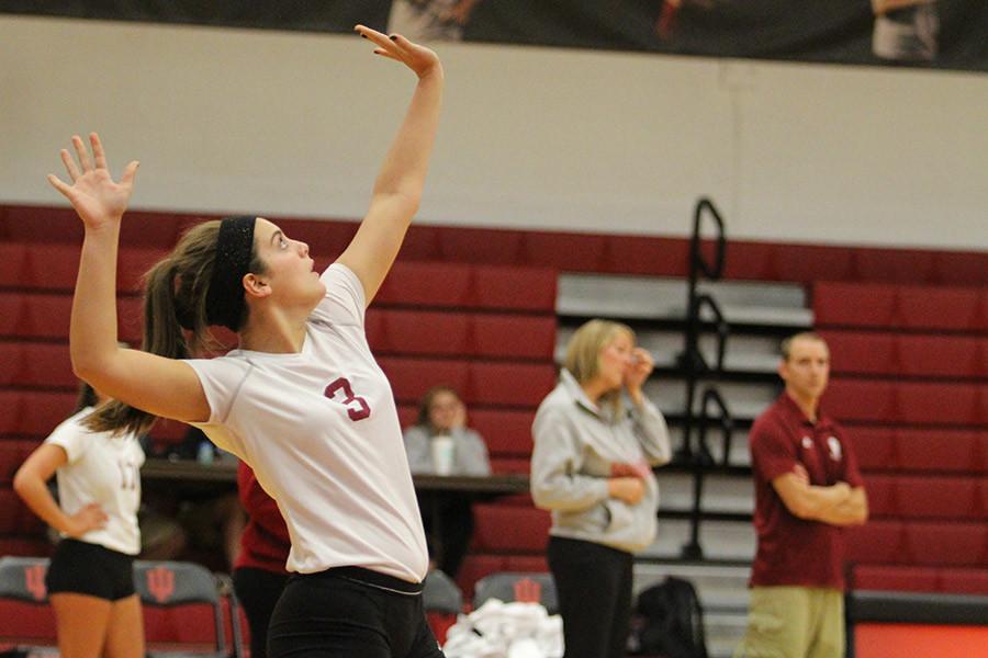 Maddie Jacobi, freshman defensive specialist, serves the ball early in the first set against IU Kokomo on Tuesday, Sept. 29. The Grenadiers lost the match in straight sets.
