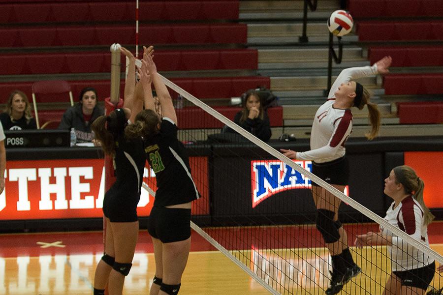 Monica Loftus, freshman right outside hitter, goes up to spike the ball against Point Park on Friday, Sept. 18. Loftus had seven kills as the Grenadiers loss in four sets.