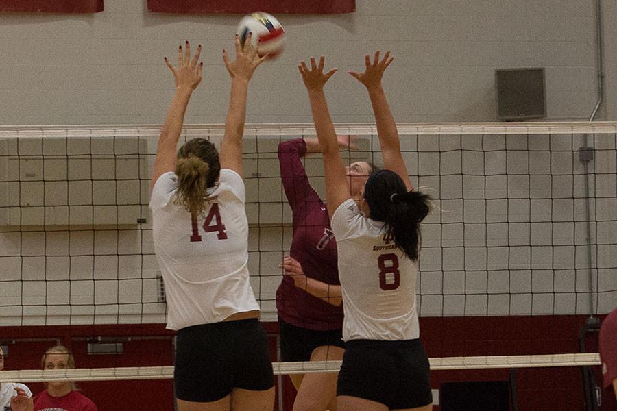 Sophomores Michala Beasley and Kelsey Willinger go up for a block against IU East on Thursday, Sept. 10. The Grenadiers defense was great getting four blocks against the Red Wolves.