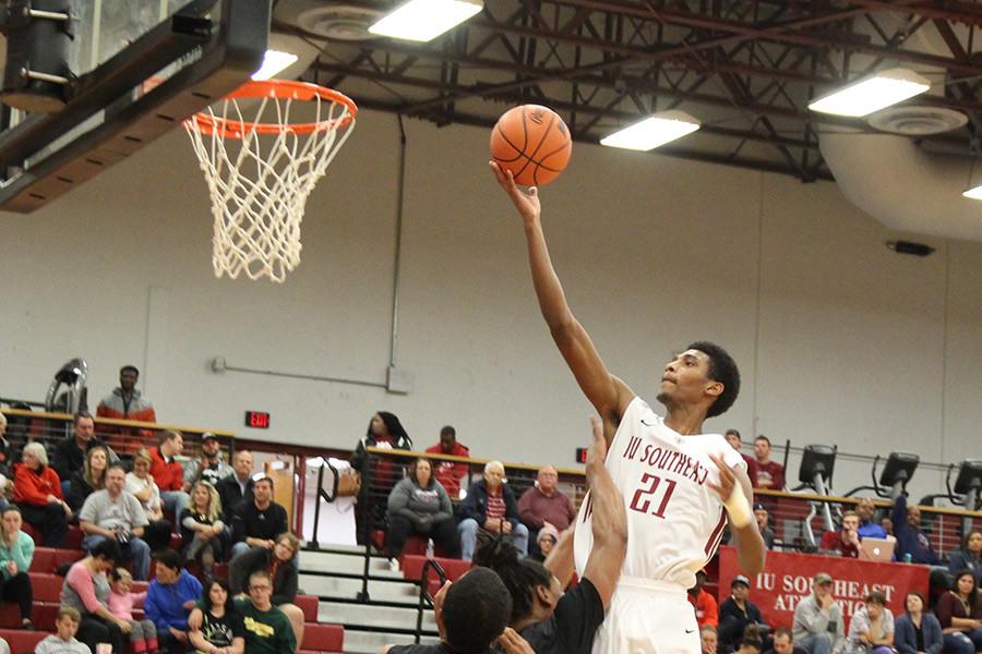 Joe Jackson, sophomore forward, goes up for a layup against St. Catharine on Tuesday, Oct. 27. Jackson finished the game with nine points and six rebounds as the Grenadiers lost by four points in their home opener.
