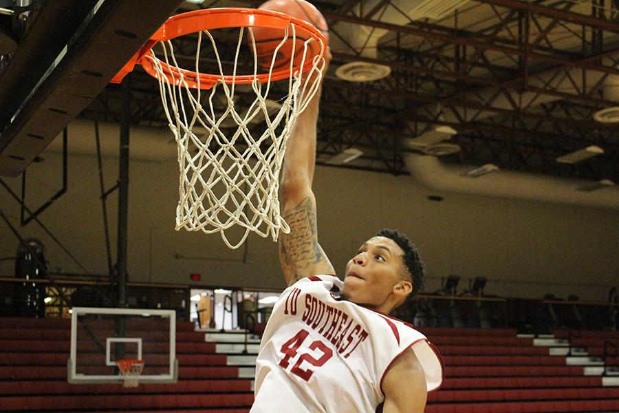Jordan Thompson, senior forward, dunking the ball in the Activities Building. Thompson is also pitching for the IUS mens baseball team during his senior year.