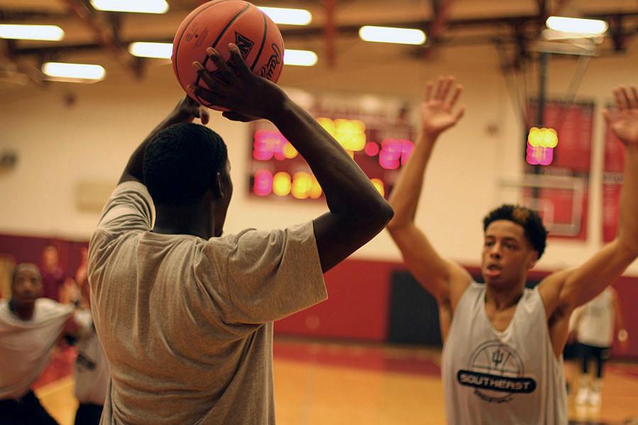 Jalen Brasher, freshman guard, guards a player in the IUS alumni game on Wednesday, Oct. 14. The Grenadiers season begins Oct. 24 against Harris-Stowe State College.