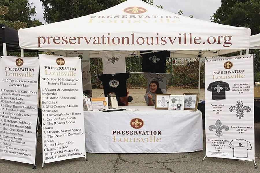 Lissa Gamsky, international business junior, at the Preservation Louisville booth at the NuLu Festival.