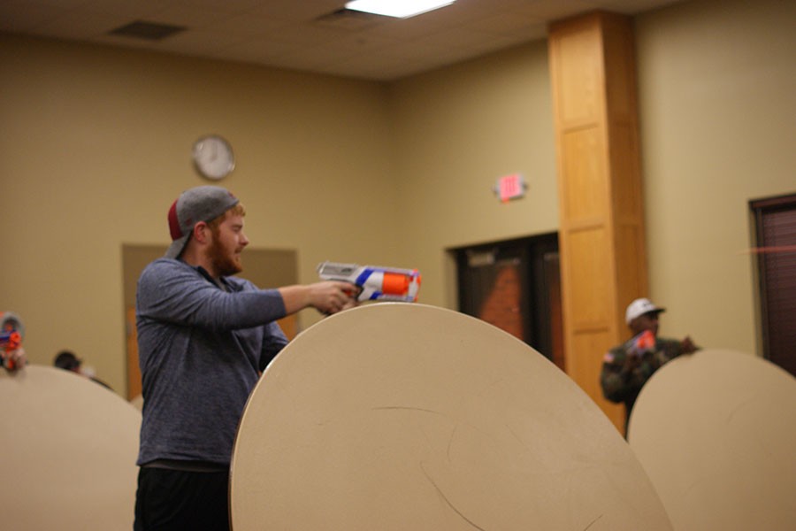 Alex Williams, history freshman, and Steven Robertson, psychology freshman, coordinate to take down their opponents during the Nerf War. Williams and Robertson won the round by using a technique called “strategic cover.”