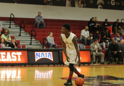 Junior guard Demetrius Stanton sets up the offense in the first half.