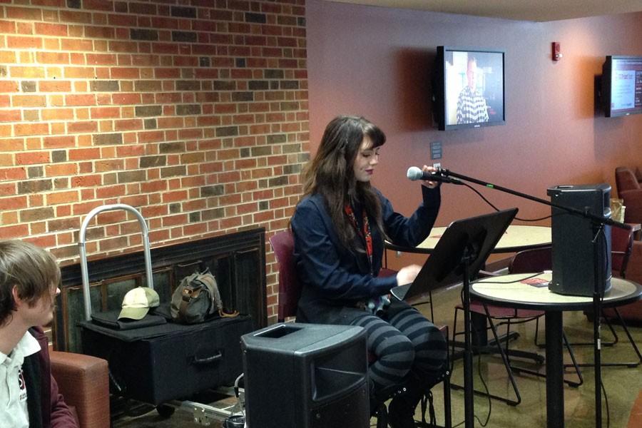 Layla Schmiedler reads a poem to students in The Commons during the SPC Open Mic on  Tuesday, Jan. 19.
