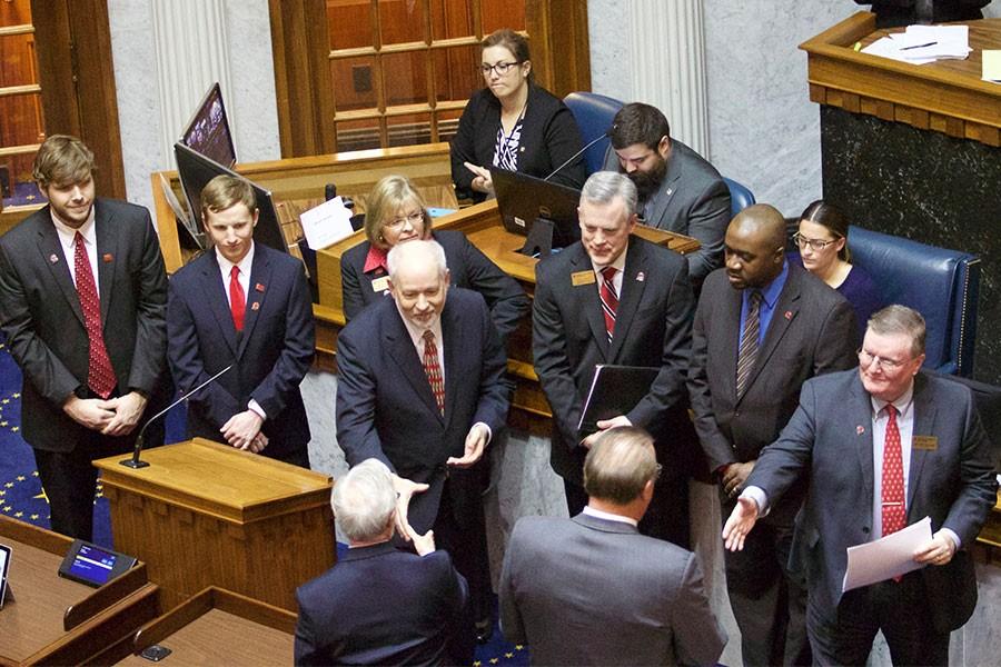 IU Vice President John Applegate and IUS Chancellor Ray Wallace prepare to shake hands with members of the Indiana House of Representatives following the hearing for the resolution that recognizes IU Southeast's 75th anniversary.  SGA vice president Parker Norfleet, SGA president Trent Wallace, Vice Chancellor of Advancement Betty Russo, Vice Chancellor for Administrative Affairs Dana Wavle and Vice Chancellor for Enrollment Management and Student Affairs Jason Meriwether and other staff members also attended the hearing from IU Southeast.