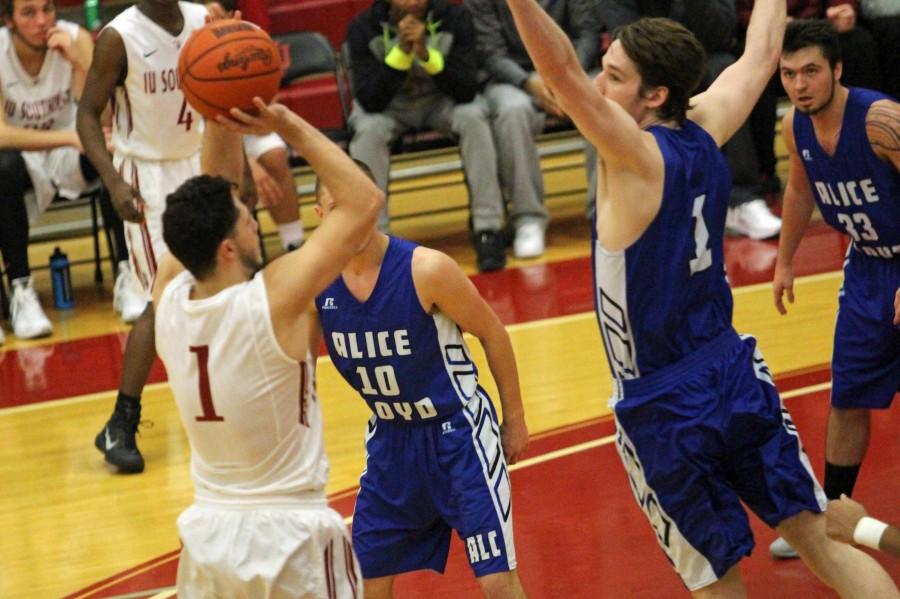 Sophomore guard Jacob Mills shoots a mid-range jump shot over the Eagles' defense.  