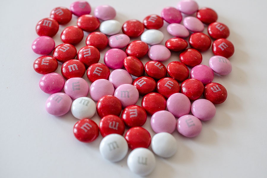This file is licensed under the Creative Commons Attribution 2.0 Generic license. Valentines day m&ms in the shape of a heart, by WikimediaCimmons user m01229