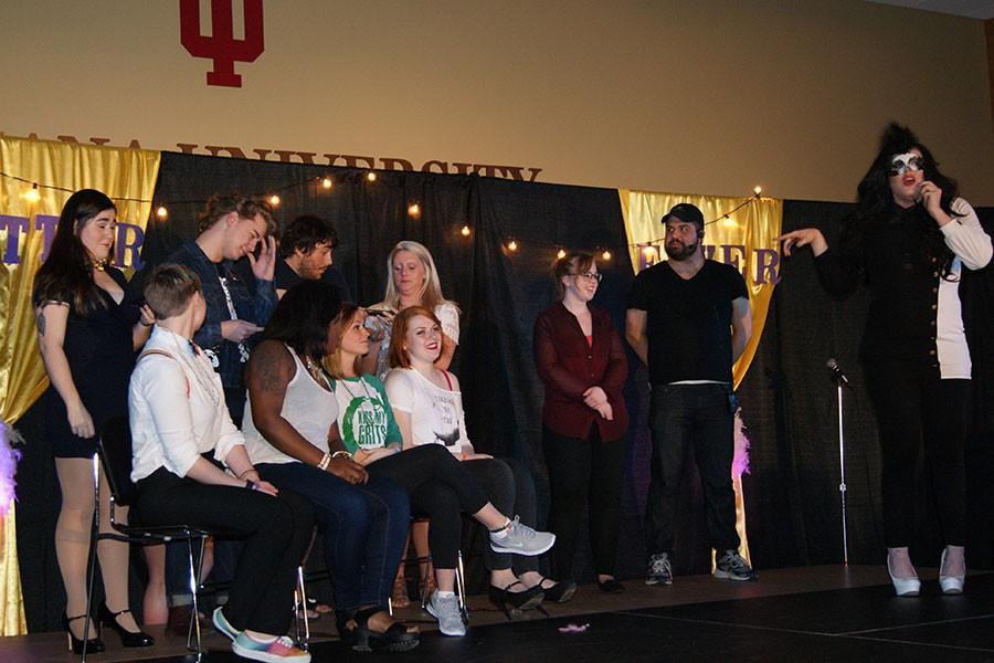 Audience members participate in “60-second Drag Queen,” a competition to see who could so the best drag makeup on their partner in 60 seconds. Kelly Howard, psychology junior and production team member, stage-manager Nicholas Moore, and emcee Lucy Panic led the game.
