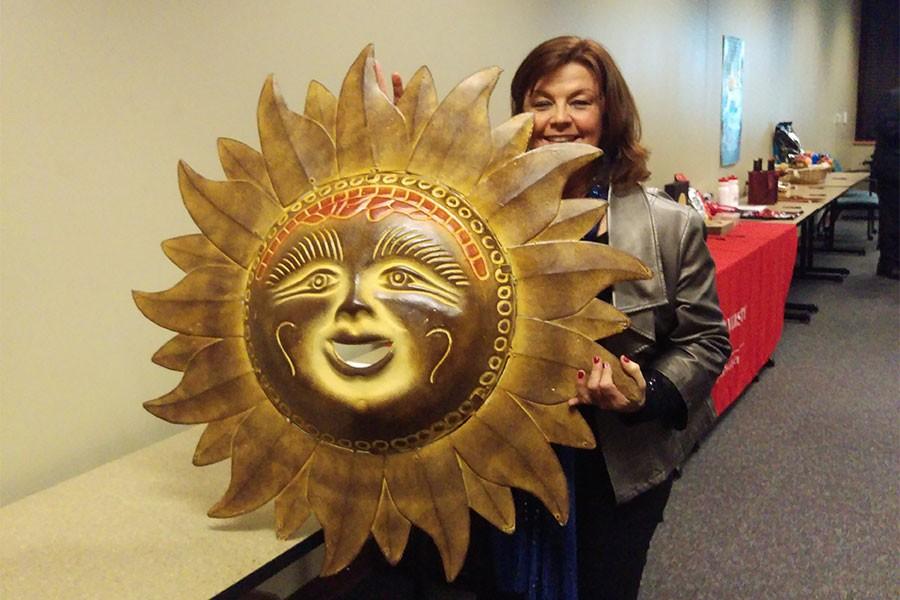Cheryl Neal, IUS alumna who received a Bachelor of Science in psychology in 1987 and a Master of Science in education in 1990, won the Mexican sun wall hanging during the silent auction that occurred during the Field Biology programs event, 20 Countries in 20 Years.
