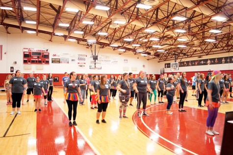 Dance marathon participants learn a dance.