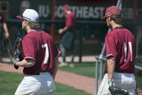 Senior outfielder Logan Coughlin (left) and Adams (right) walking back to the dugout after warming up.