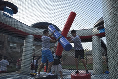 Adan Diaz, business senior (left), and Evin Young, business sophomore (right), joust in the ring during the Kappa Sigma Gladiator Competition.