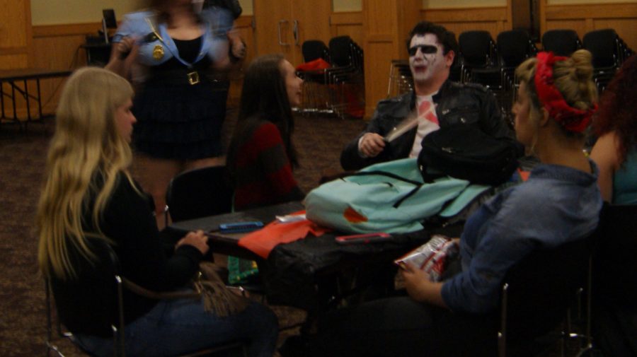 Partygoers talking among themselves during the Halloween Party. Later, they would take to the dance floor and dance to some hit dance songs.