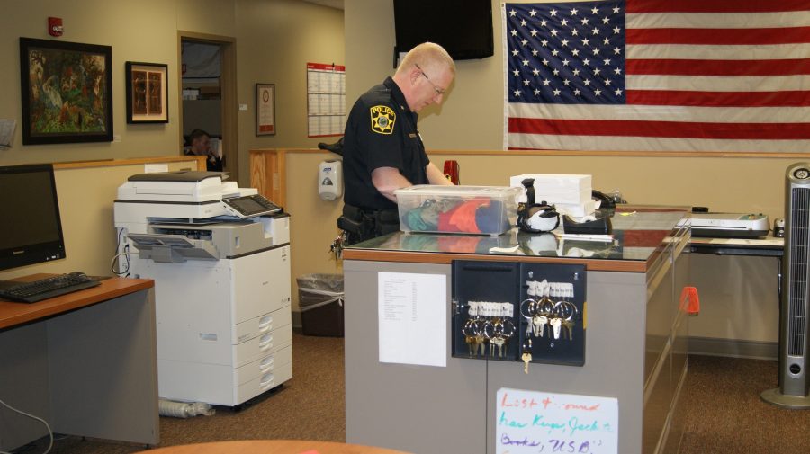IUS Police Chief Charles Edelen filing reports, just one of his many duties in the IUS Police Station.
