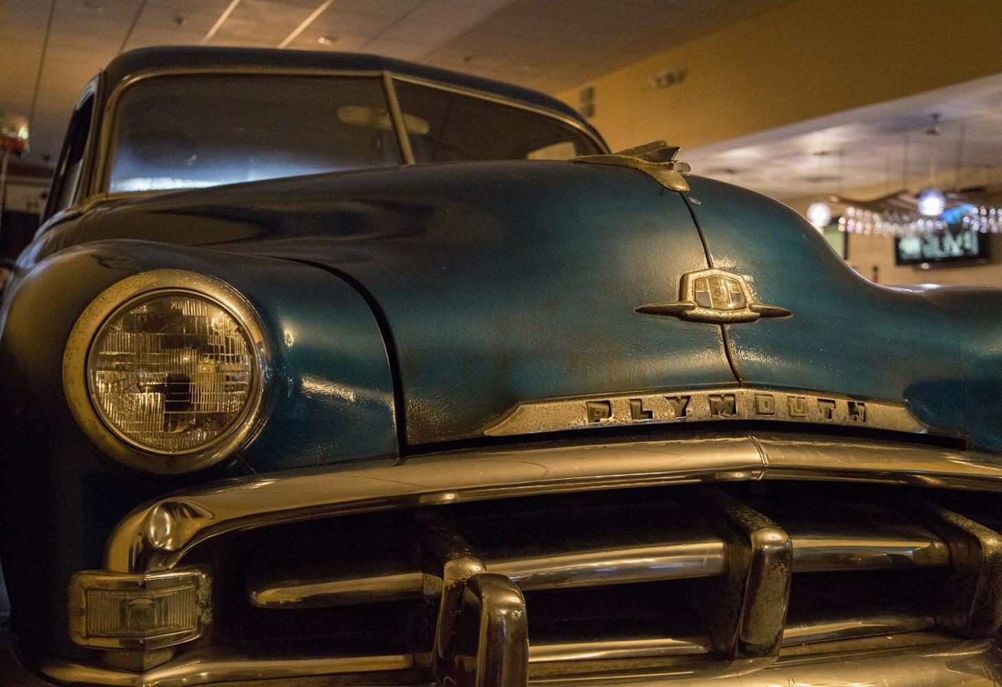 Parked in the restaurant is a 1951 Plymouth