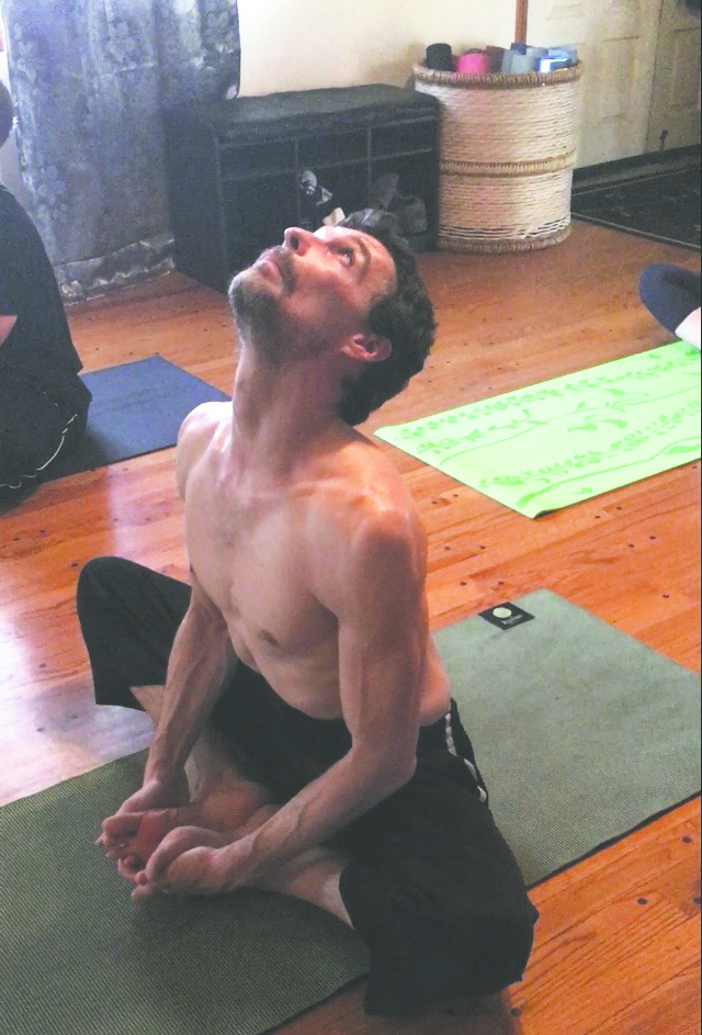 Glenn Brown practiced yoga with his students instead of walking around them or sitting down like most instructors might.