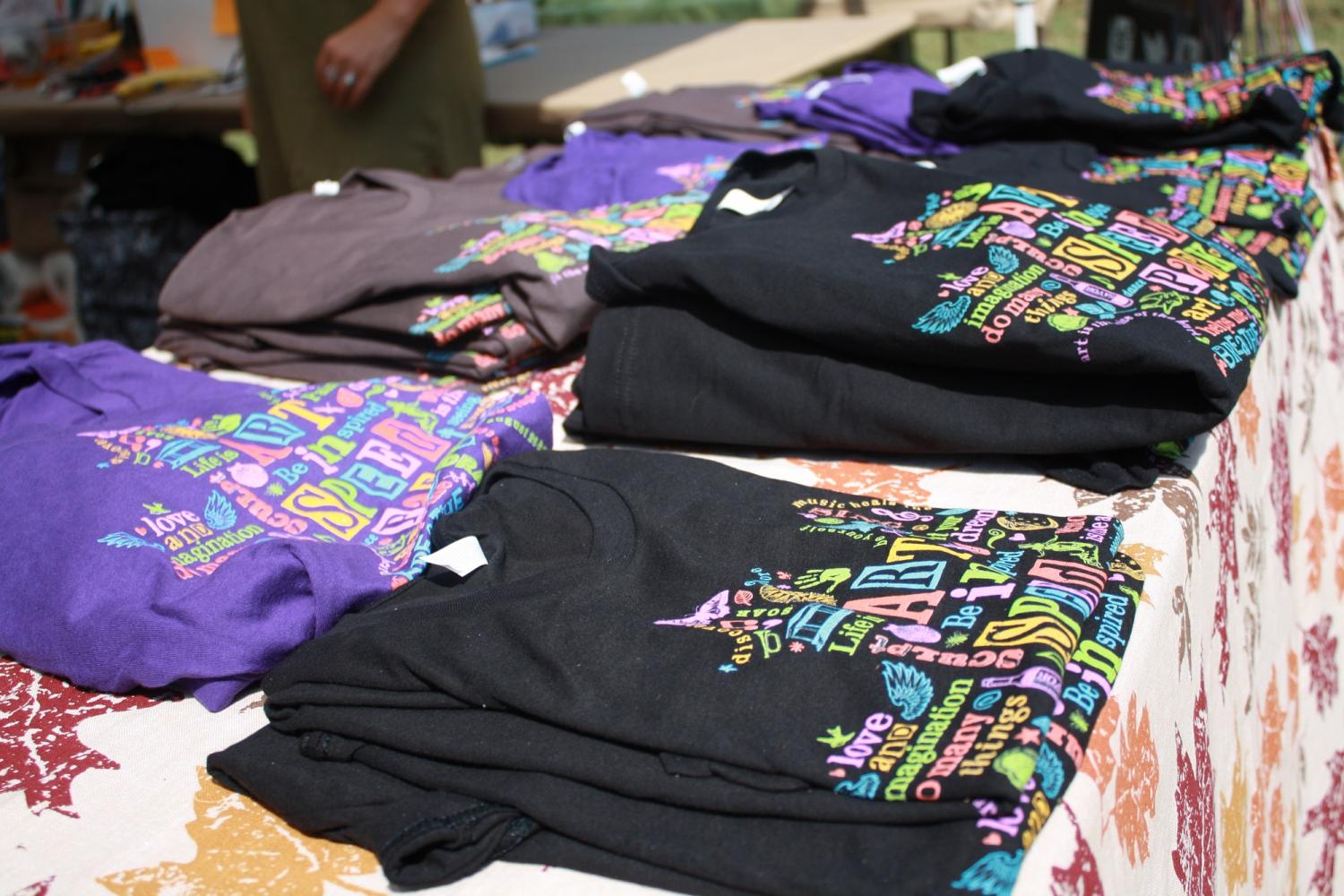 A selection of 2017 Art In Speed Park tee shirts, designed by Doreen DeHart, were featured at the information booth for purchase to commemorate the weekend. 