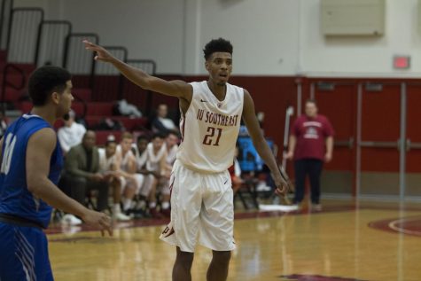 Joe Jackson, senior forward, yells out directions to the offense against IU Kokomo on Tuesday, Jan. 30.