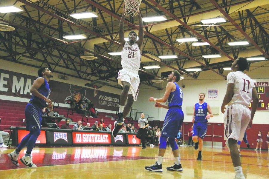 Joe Jackson, senior forward, jumps toward the basket for a dunk against Ohio Christian. Jackson is one of the nation’s best defensive players, leading NAIA Division II in both total blocks and blocks per game.