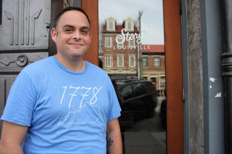 CEO of Yes Louisville, Jason Mudd, poses next to his office building wearing a Yes Brand shirt in Nulu, Louisville.