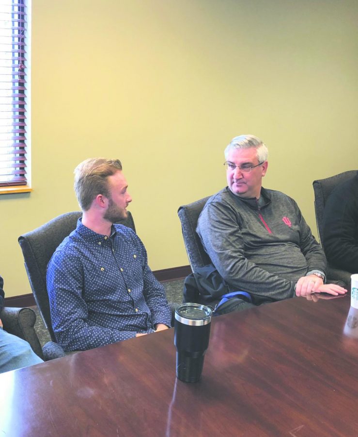 Roger Howard, chairman of the Federation of College Republicans, talks with Indiana Gov. Eric Holcomb during a meeting at IU Southeast on Saturday, April 7. Photo courtesy of Roger Howard.