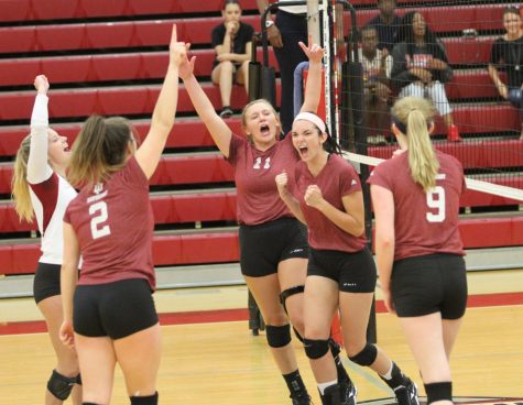 The volleyball team celebrates a point during a home match against Cincinnati Christian University last season. The Grenadiers home opener will fall on Thursday, Aug. 30, at 7 p.m. against St. Mary-of-the-Woods.