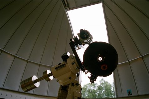 Dr. Gerald Ruth and his wife Ellen in front of
the IUS observatory. Photo by John Clere