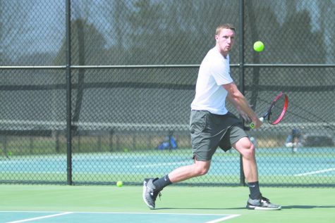 Junior Sam Venter sets up a backhanded return in a Spring 2018 match. Venter is one of four juniors who Epkey believes will lead the men's team this season.