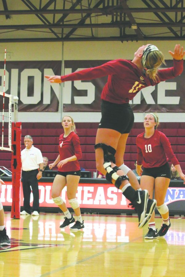 Senior outside hitter Monica Loftus rises up for a hit against Lindsey Wilson College. Loftus finished the match with 10 kills. Photo by Tamar Kelly.