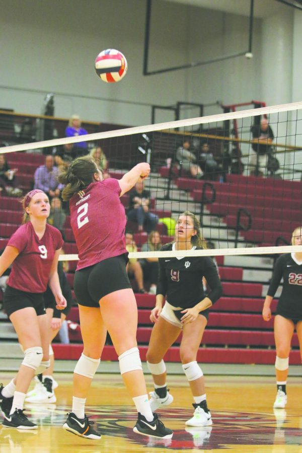 Hannah Sipe sets the ball for an outside hitter in the Grenadiers 3-0 loss to IU Kokomo. Sipe finished the match with 20 assists to lead the Grenadiers. Photo by Tamar Kelly.