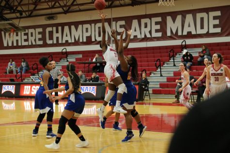 Junior guard Aaliyah Bell drives and rises up for a layup attempt in the women's 100-54 Homecoming win against Fisk University (Tenn.).