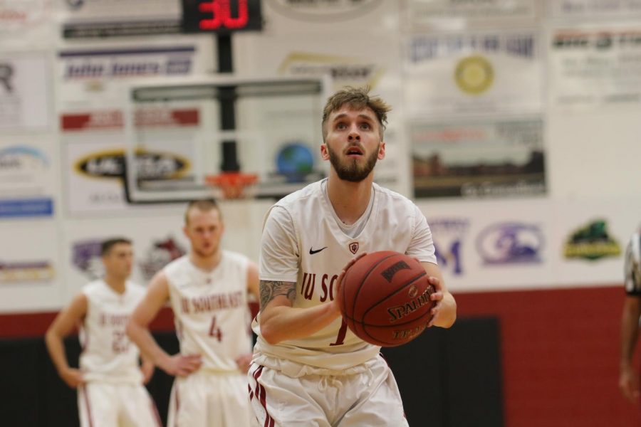 Freshman guard Brian Alvey attempts a free throw in the Grenadiers 114-64 Homecoming victory. Alvey led the Grenadiers with five 3-pointers and finished the contest with 16 points. Photo by Tamar Kelly.